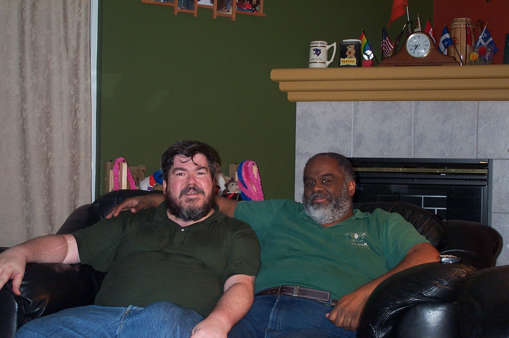 Gary and me by the fireplace with our green shirts