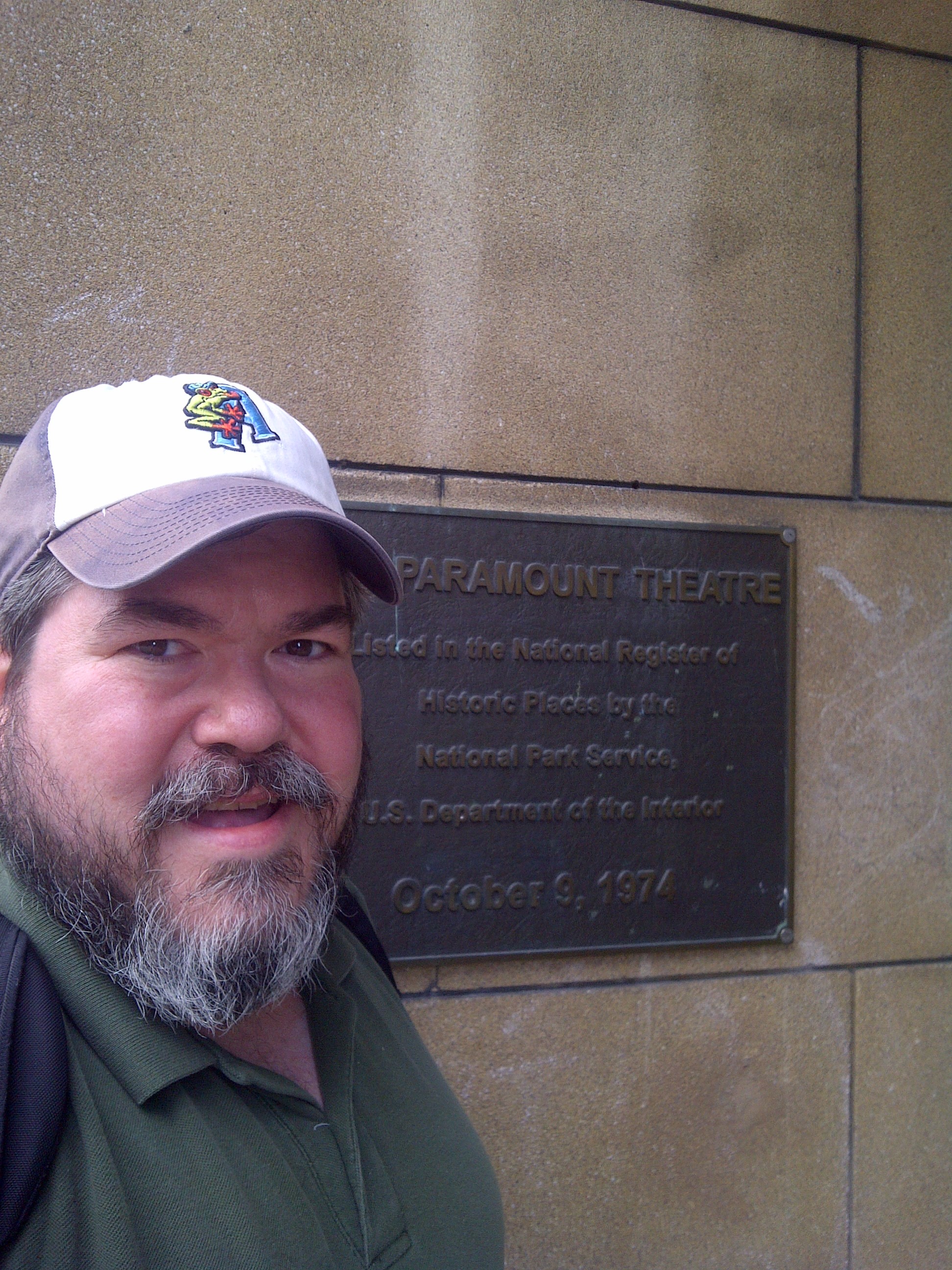 bigmacbear standing beside the cornerstone of the Paramount Theater, Seattle